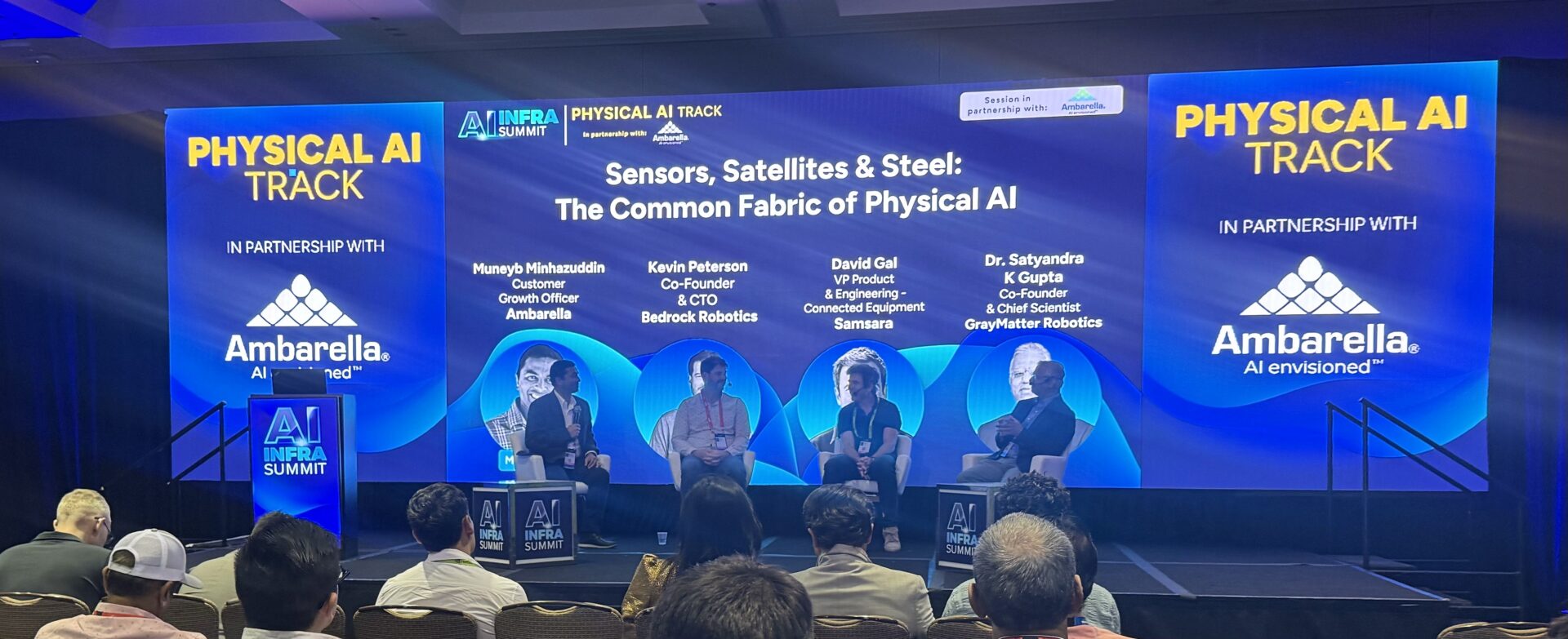 Panel discussion participants sitting on stage