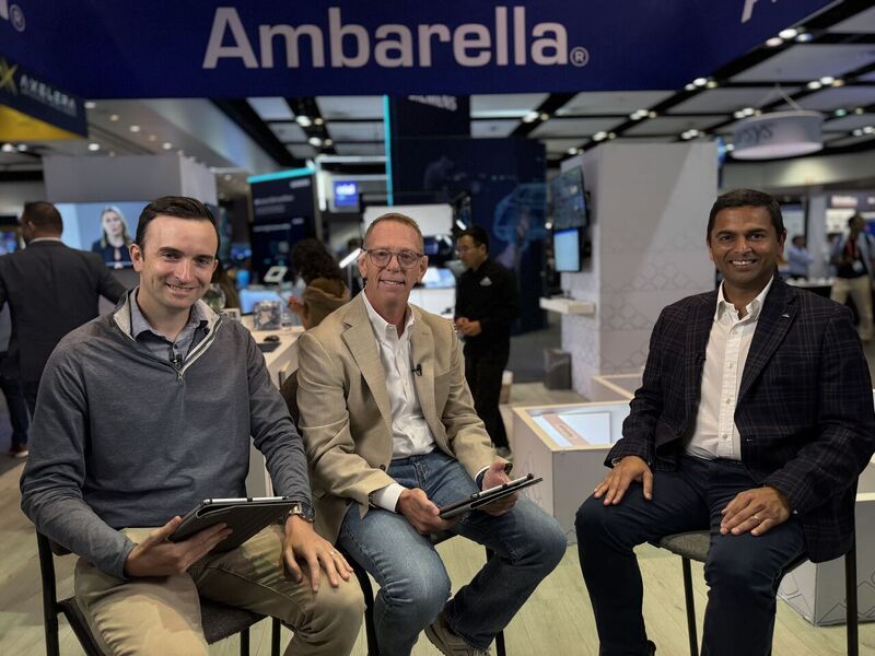 Three people sitting for a podcast recording at the Ambarella exhibition booth